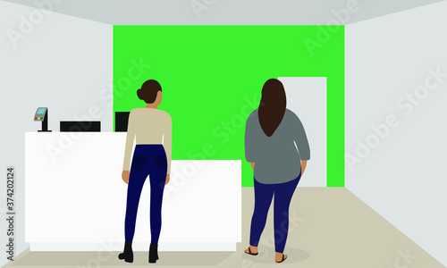 Two female characters stand in a room near a table with a terminal for payment and wait for an employee