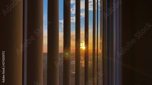 sunset through window blinds