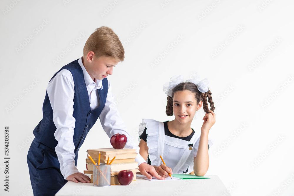 Two schoolchildren in uniform are studying.
Boy teaches girl
school assignment. Textbook in mathematics. Happy children study together.
Educational process and education.
Back to school concept Two schoolchildren in uniform are studying.
Boy teaches girl
school assignment. Textbook in mathematics. Happy children study together.
Educational process and education.
Back to school concept