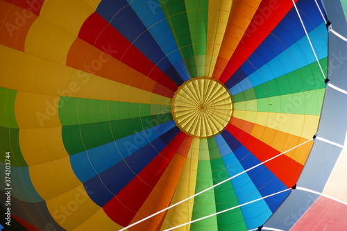Rainbow colored inside of inflated hot air balloon