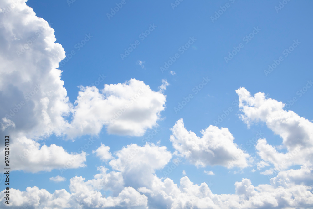 Bright blue sky background with clouds in sunny weather. Wallpaper. Bright blue sky background with clouds in sunny weather. Wallpaper.