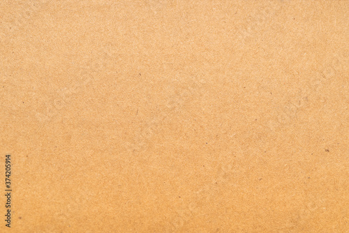 Close-up of pressed beige cardboard texture 