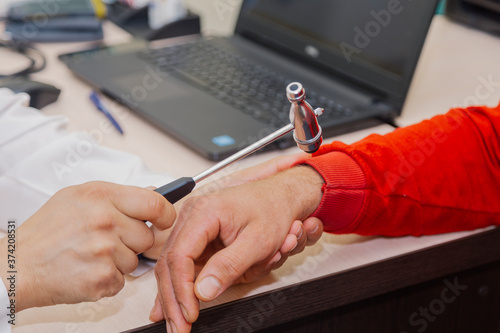 Doctor neurologist examines a patient in a clinic.