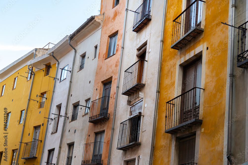 Colorful facade of buildings in Cuenca Spain during summer day