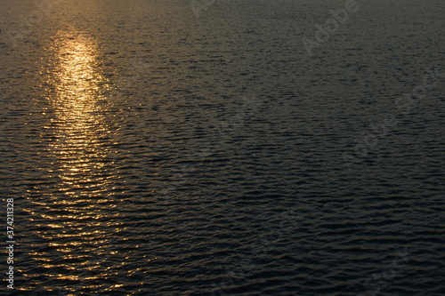 A reflection of the sun on water. There are the sun track, morning freshness, ripples and beauty. 