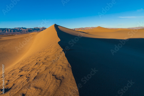 Star Dune is the Tallest of Mesquite Flat Sand Dunes With The Kit Fox Hills and the Armagosa Mountain Range in the Distance, Death Valley National Park, California, USA
