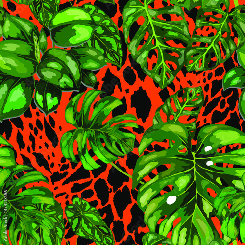 Tropical seamless pattern on animalistic texture. Jungle exotic summer print. Summer tropical leaf. Tropical flower fashion pattern. Floral tropic illustration. Vector seamless pattern.