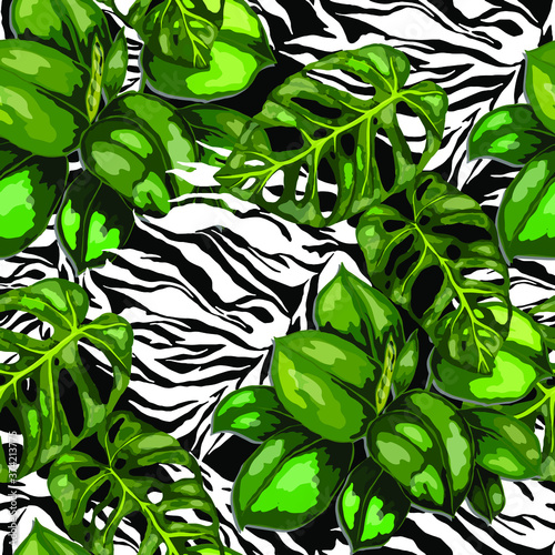 Tropical seamless pattern on animalistic texture. Jungle exotic summer print. Summer tropical leaf. Tropical flower fashion pattern. Floral tropic illustration. Vector seamless pattern.