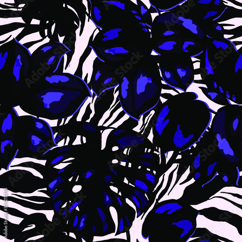 Tropical seamless pattern on animalistic texture. Jungle exotic summer print. Summer tropical leaf. Tropical flower fashion pattern. Floral tropic illustration. Vector seamless pattern.
