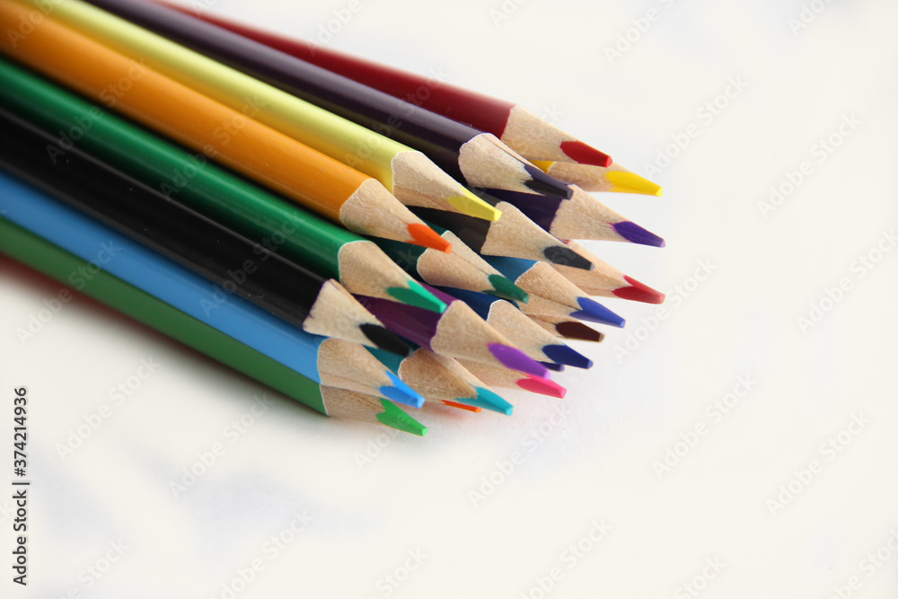 colored pencils on white background