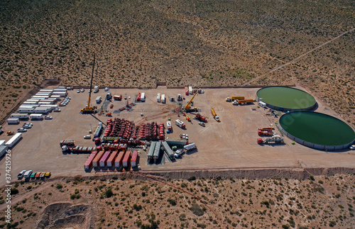 Vaca Muerta, Argentina, November 23, 2013: Extraction of unconventional oil. Water tanks for hydraulic fracturing. photo