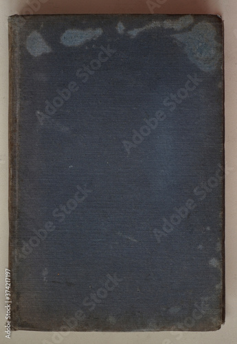 The cover of an old book is blue on a white background