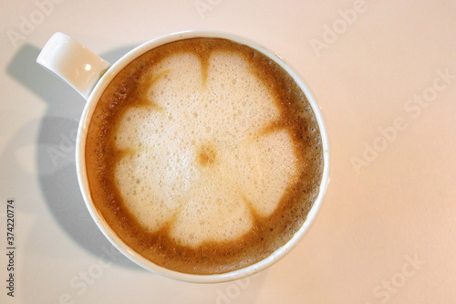 cup of hot latte art coffee