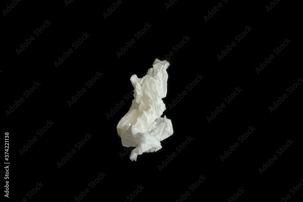 Used paper tissue on black background, top view Used paper tissue on black background, top view