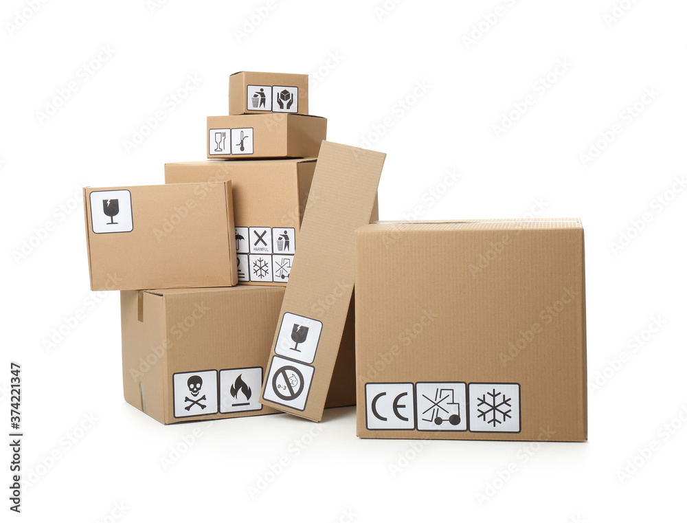 Cardboard boxes with different packaging symbols on white background. Parcel delivery Cardboard boxes with different packaging symbols on white background. Parcel delivery
