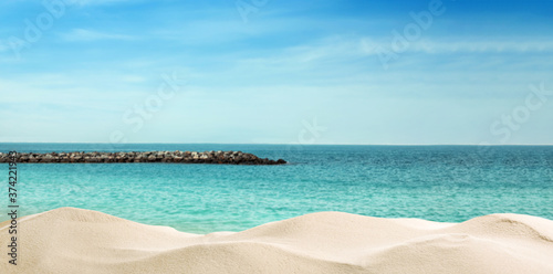 Beautiful beach with golden sand near ocean. Banner design