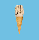 fresh milk tea flavor ice cream cone on a blue background square composition