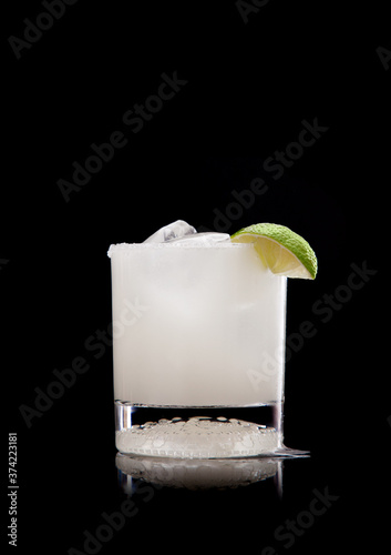 Scratch margarita in old fashioned glass on black background