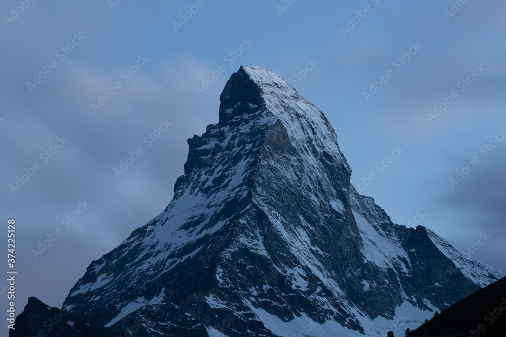Matterhorn summit beautiful view long exposure shot at dusk taken from Zermatt Swiss Alps Switzerland