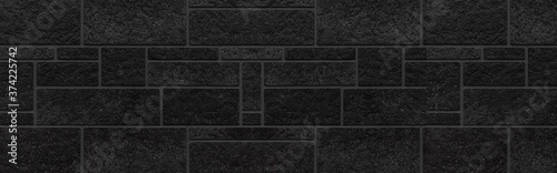 Panorama of Block pattern of black stone cladding wall tile texture and seamless background photo
