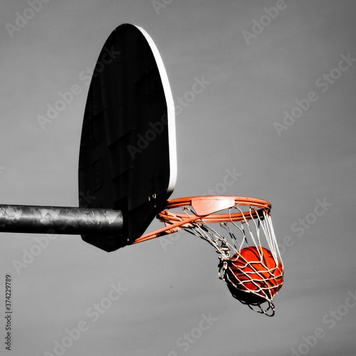 basketball swoosh in basketball net on the street