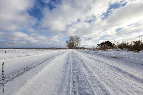 narrow snow-covered winter road