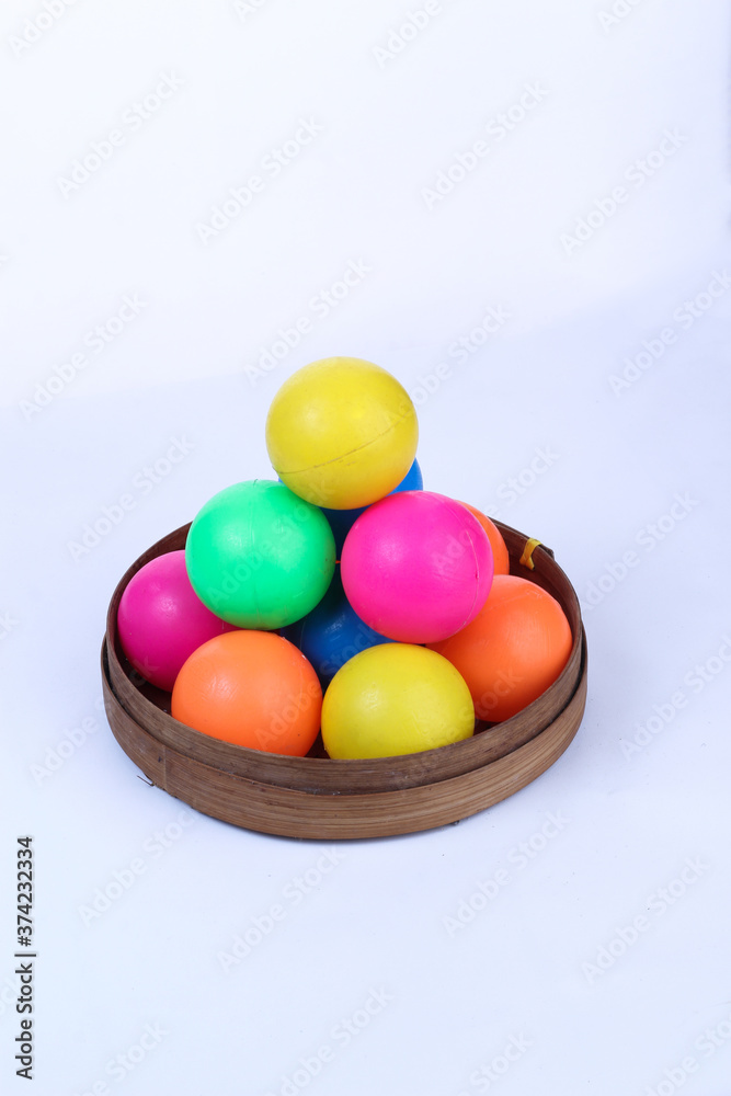 colored ballsin the bamboo basket