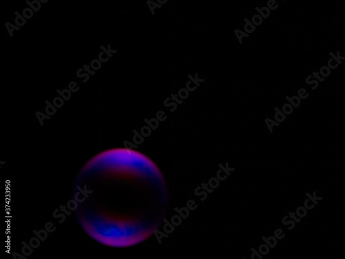 Soap bubble on black background