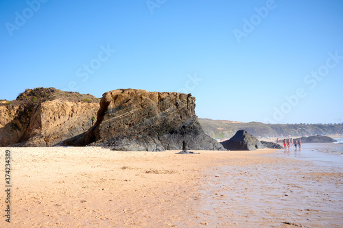large rock on the beach ol almograve photo