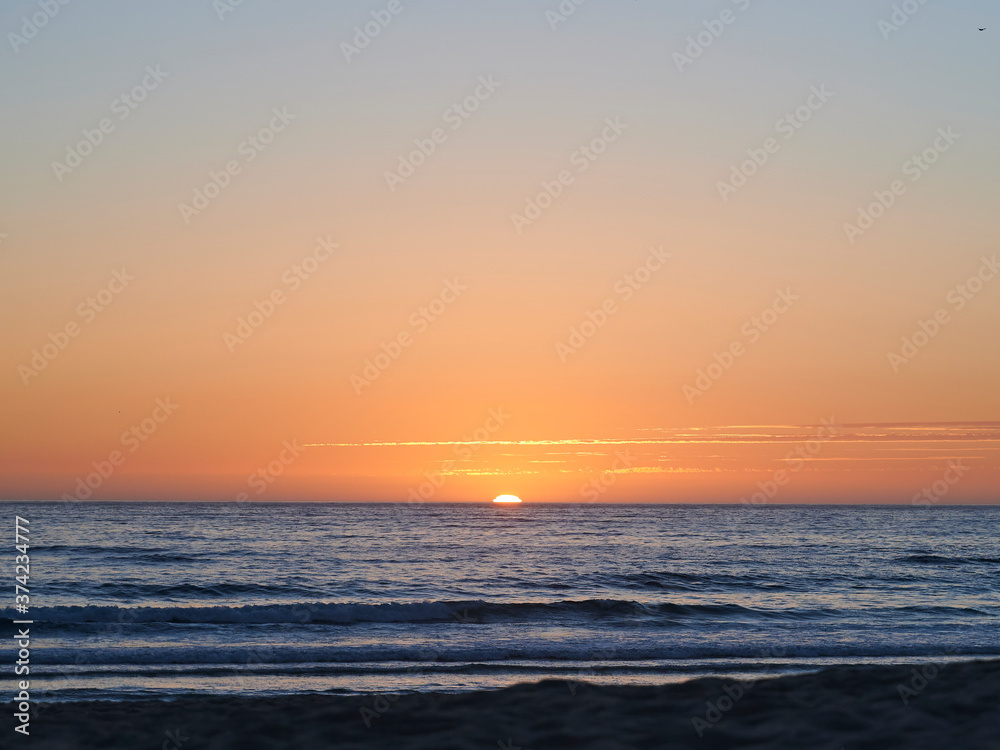 sun setting on the ocean 