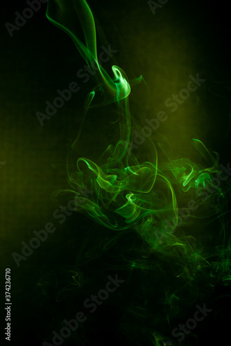 Green smoke motion on black background.