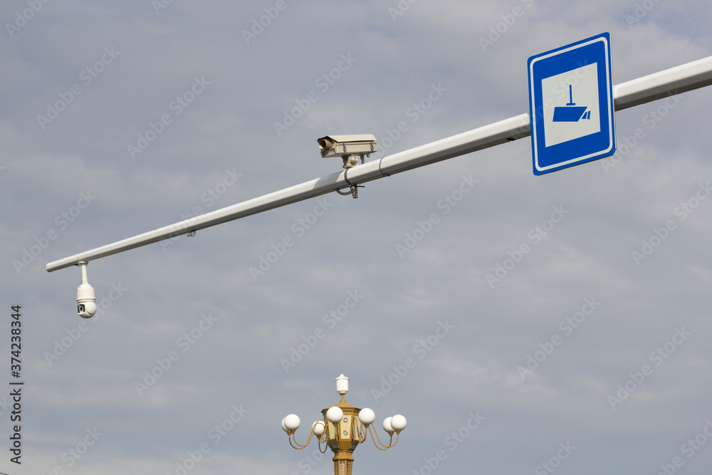 Traffic cameras and sign on a city street in northeastern China. Traffic cameras and sign on a city street in northeastern China.