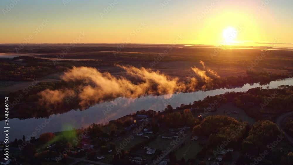 Drone view of sunrise over Elk Lake with fog Drone view of sunrise over Elk Lake with fog