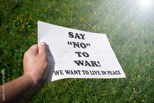 Peace demonstration in Washington DC-  Say NO to war. We want to leave in peace. Message written on a banner held in the hand- Concept for peace, against war
