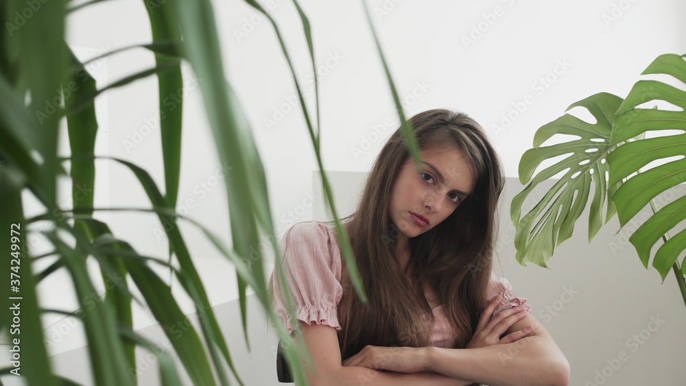 Fototapeta premium Portrait of Professional young woman model looking at camera