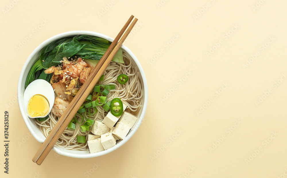 Miso Ramen Asian noodles with egg, tofu, and pak choi cabbage in bowl. Japanese cuisine. Miso Ramen Asian noodles with egg, tofu, and pak choi cabbage in bowl. Japanese cuisine.