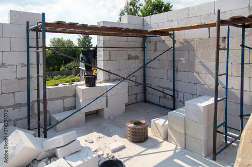 Construction of the walls of the house from foam concrete bricks.