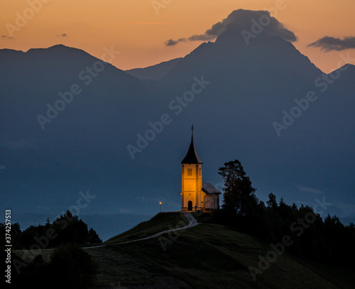 small slovenian church in the morning on the hill