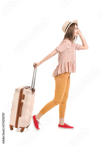 Young woman with suitcase on white background. Travel concept