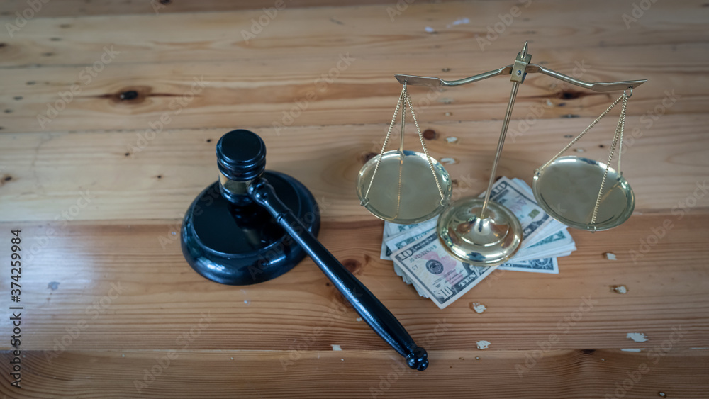 Gold scales were placed on silver, and the hammer of justice was on the wooden table. Gold scales were placed on silver, and the hammer of justice was on the wooden table.