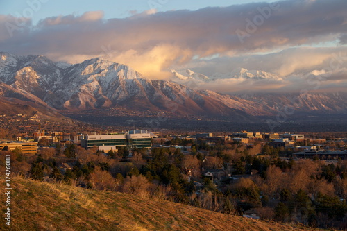 Fototapeta Naklejka Na Ścianę i Meble -  Salt Lake City in winter and Mount Olympus with interesting sunset clouds