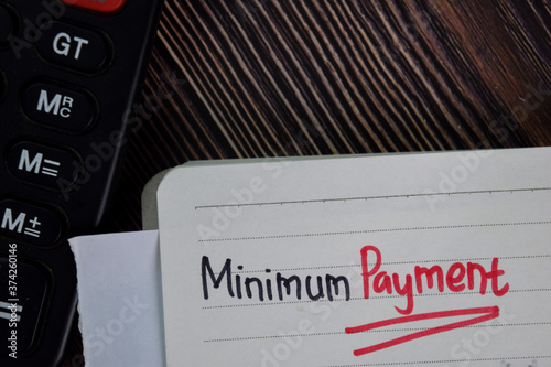 Obraz na płótnie Minimum Payment write on a book isolated wooden table.
