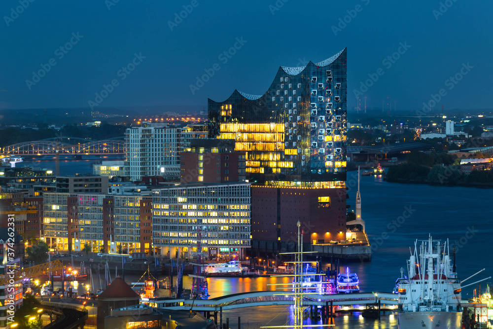 The new modern architecture of the Elbphilharmonie of Hamburg Germany at dawn with harbor