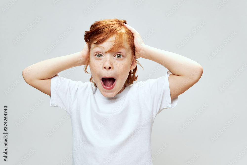 cute boy with red hair with an open mouth and a silly face Copy Space cute boy with red hair with an open mouth and a silly face Copy Space