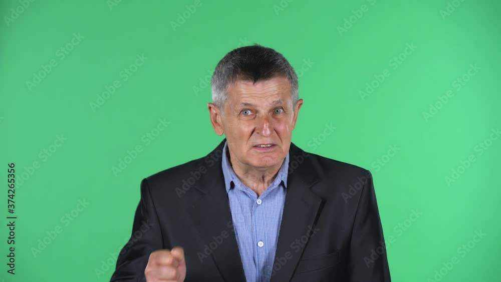 Portrait of aged man looking at the camera with excitement, then celebrating victory triumph isolated over green background. Portrait of aged man looking at the camera with excitement, then celebrating victory triumph isolated over green background.