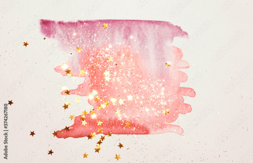 Golden glitter and glittering stars on abstract pink watercolor splash in vintage nostalgic colors on light gray background	