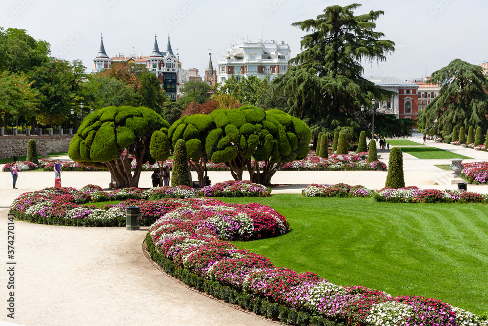 Beautiful Park with a lot of green trees and bushes in Madrid, Span in September during the sunny day