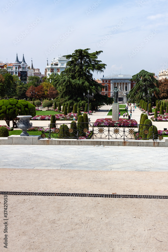 Beautiful Park with a lot of green trees and bushes in Madrid, Span in September during the sunny day