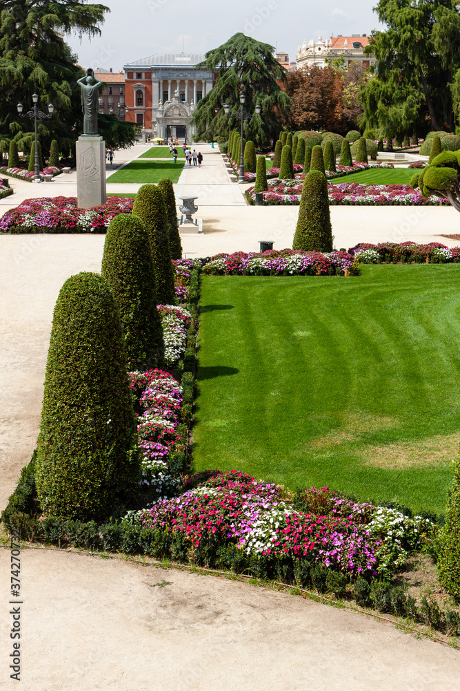 Beautiful Park with a lot of green trees and bushes in Madrid, Span in September during the sunny day