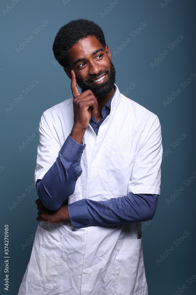 Beautiful afro doctor in front of a background Beautiful afro doctor in front of a background